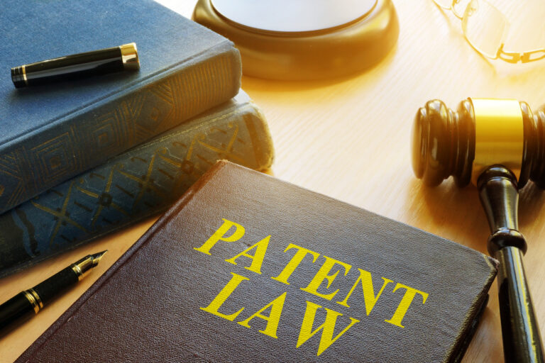 Book about Patent Law and gavel. Copyright concept