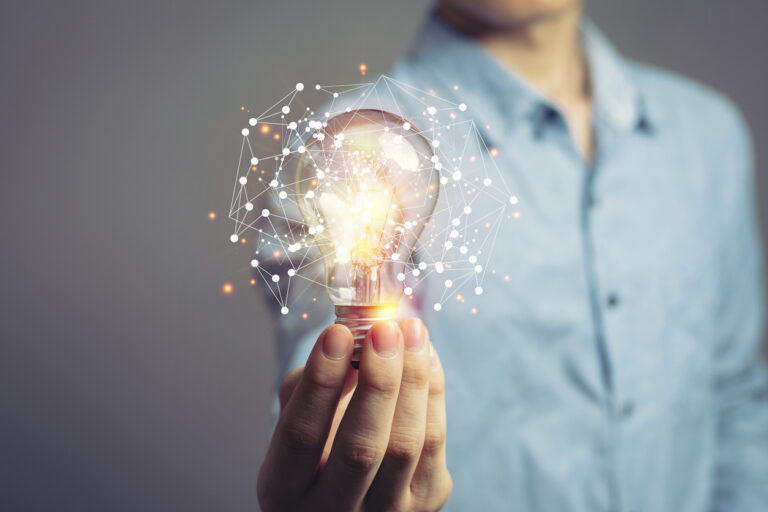 Man holding light bulbs, ideas of new ideas with innovative technology and creativity